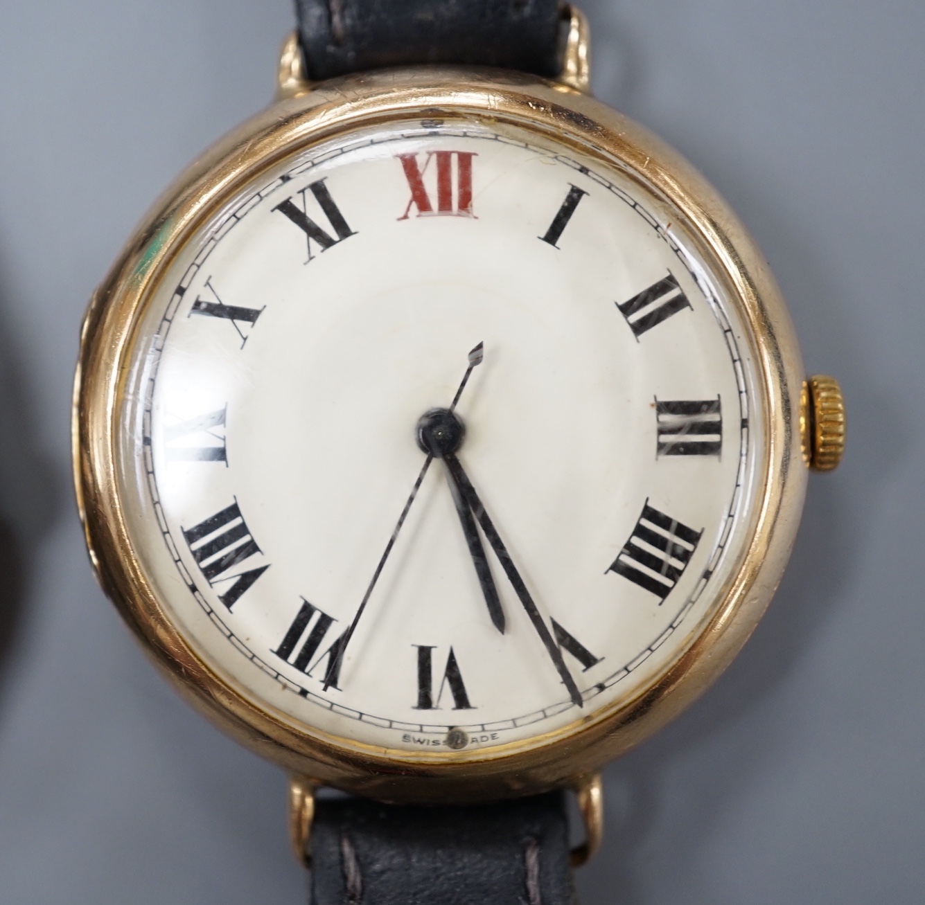 A gentleman's 1930' 9ct gold manual wind wrist watch, on a leather strap, 27.5 grams and a similar stainless steel Watches of Switzerland Seafarer Quartztronic watch.